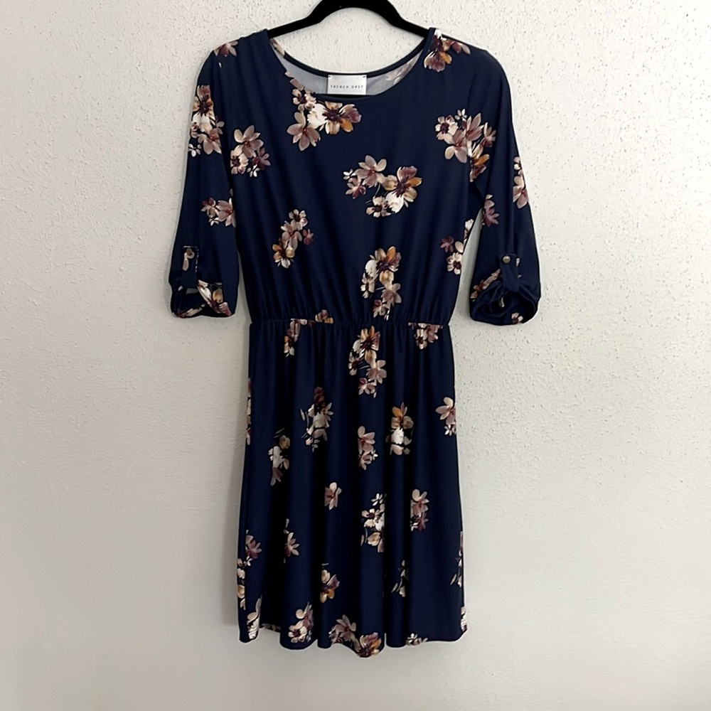 Casual navy blue dress with tan and mauve flowers